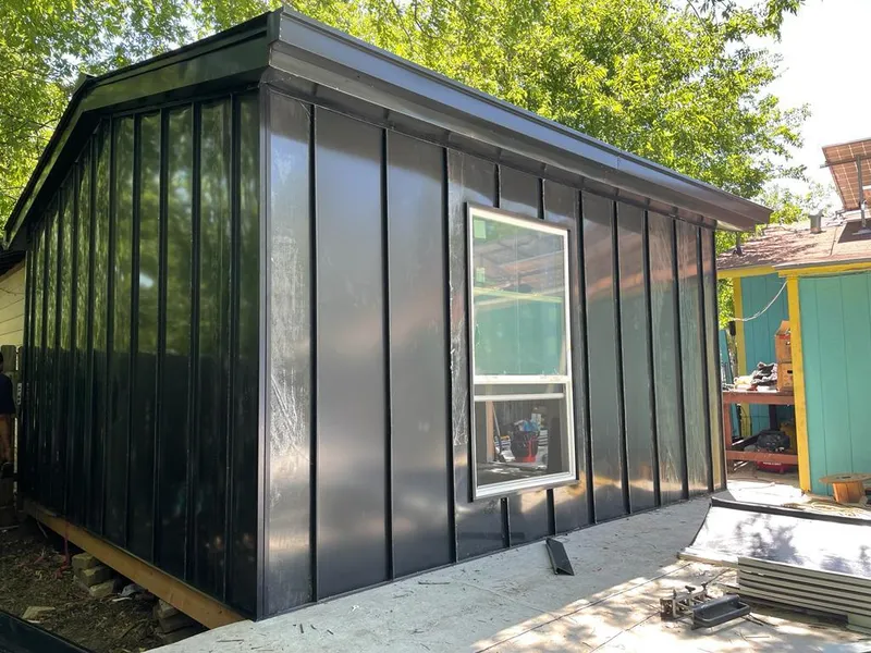 Black standing seam metal wall panels for Roof Inspection in Laredo